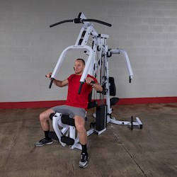 The strengthtech exm2500s home gym has a press station and pec dec station