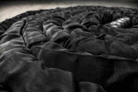If you're going to be using your battle ropes on concrete or other rough surfaces then you might want to consider the version with the full nylon sleeve