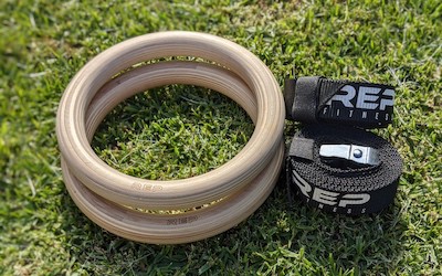 Rep Fitness wooden gymnastic rings on grass