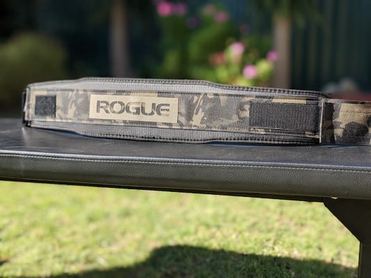 large view of rogue fitness usa nylon lifting belt on weight bench outdoors