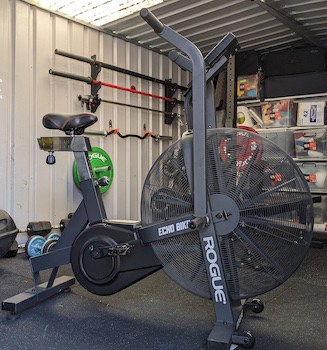 A rogue echo air bike in a home gym