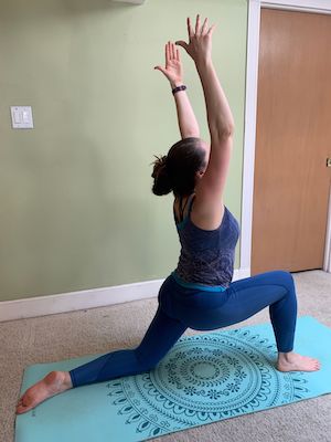 Author doing crescent lunge yoga stretch to improve flexibility