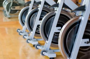 row of exercise bike flywheels