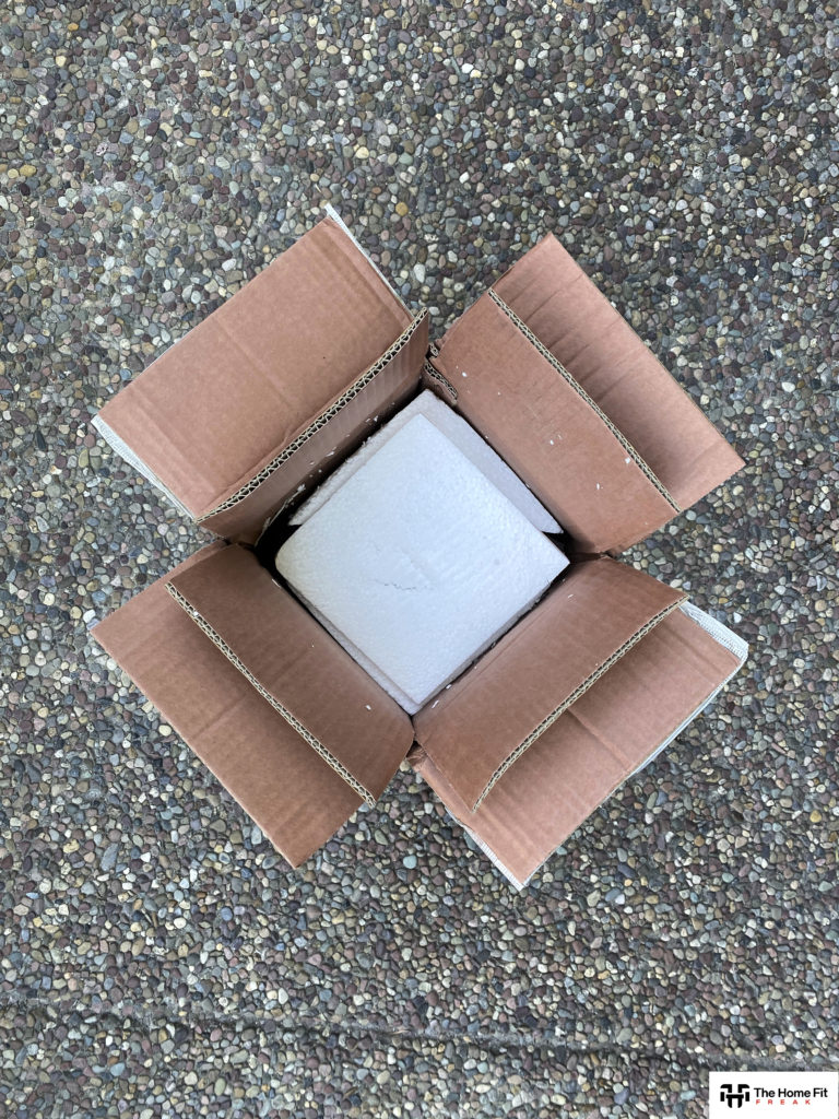 Top-down view of a box with styrofoam padding